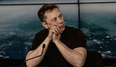 Elon_Musk_at_a_Press_Conference-scaled-e1666686607312.jpg
