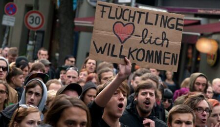 refugees_welcome_berlin-e1653993524280-900x550-1-900x550-1-e1668608801686.jpeg