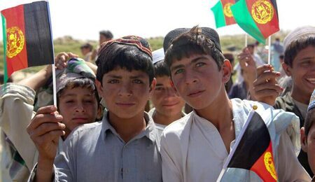 afghan-boys-waves-their-flags-to-afghanistan-uniformed-c87a8e-e1668092362514.jpg