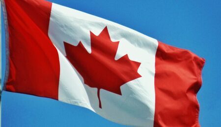 country-photo-red-flag-maple-emblem-634249-pxhere.com_-e1648237095292.jpg