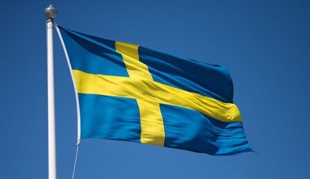 1599px-Flag_of_Sweden_2-e1649851339779.jpg