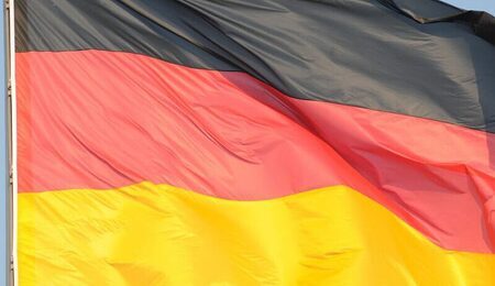 germany-flag-black-red-gold-reichstag-e1649001744240.jpg