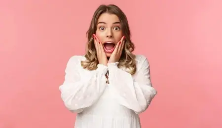 happy-surprised-blond-girl-hear-awesome-news-gasping-speechless-staring-camera-with-hands-cheeks-being-impressed-stunned-great-event-standing-pink-background_1258-93570.jpg-e1680530123286.webp
