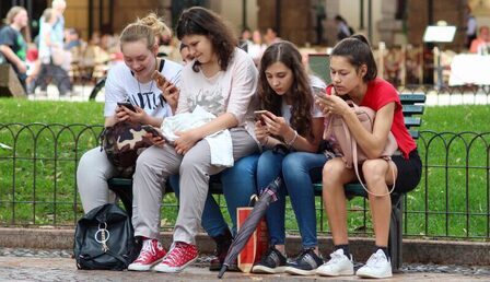 1599px-Distracted_by_Phones-e1686122723421.jpg