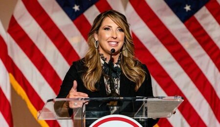 Ronna-McDaniel-flags-e1695795711206.jpeg