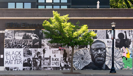 George_Floyd_street_art_painted_on_plywood_at_Fifth_Element_in_Minneapolis_Minnesota_50022633941-scaled-e1708418161486.jpg