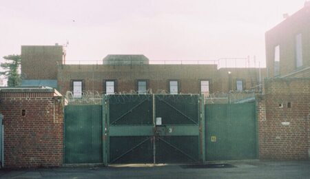 Campsfield_House_inside_gate-1-scaled-e1768988026768.jpg